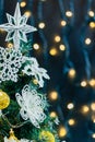 Beautiful decorated christmas tree with snow on the blurred bokeh of the garland. Holiday background Royalty Free Stock Photo