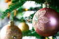 Beautiful decorated Christmas tree. with various hanging Christmas balls on the tree, Christmas background, gold and pink balls