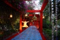 Beautiful decorated entrance with floral decoration and lamps at indian wedding or reception ceremony, outdoor evening