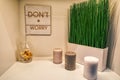 Beautiful decoration with candles, green grass and a dont worry sign