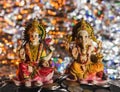Beautiful decoration of Ganesh-Lakshmi statues in Diwali on a pile of coins
