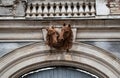 Beautiful decoration of the gate in old palace. Horses heads. Urban motif. Architectural detail, decor