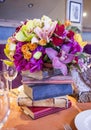 Beautiful decoration of restaurant with flowers and books.