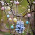 Beautiful decorative birdcage in the branches of a blossoming apple tree