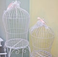 Beautiful decorative cages with pink ribbons