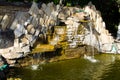 Decorative garden stone waterfall pond Royalty Free Stock Photo