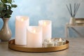 Beautiful decorative LED candles on grey table Royalty Free Stock Photo