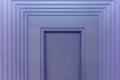 Beautiful decorative portal made of moldings on a purple wall. Modern trends in decor and interior design. Close-up