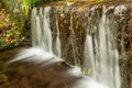 Beautiful decorative stone waterfall pond in garden Royalty Free Stock Photo