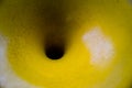 Black hole funnel on old yellow color surface. Royalty Free Stock Photo