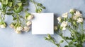 Beautiful and delicate bouquet of white  roses lies on a blue background with white pure box present. Valentines day Royalty Free Stock Photo