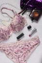 Beautiful delicate lingerie, panties and bra on white background with perfume Royalty Free Stock Photo