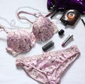 Beautiful delicate lingerie, panties and bra on white background with perfume Royalty Free Stock Photo