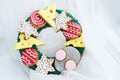 Beautiful and delicious gingerbread with pieces of cheese, mouse, balls for the Christmas tree