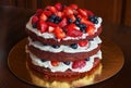 Beautiful delicious red velvet cake with strawberries and blueberries Royalty Free Stock Photo