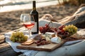 Beautiful delicious romantic still life with bottle of red wine, glasses and grapes. Sandy beach, lake, sunset in background. Royalty Free Stock Photo