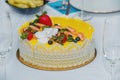 Beautiful delicious yellow cake with fruit and caramel decorations with a smooth jelly surface Royalty Free Stock Photo