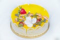 Beautiful delicious yellow cake with fruit and caramel decorations with a smooth jelly surface Royalty Free Stock Photo