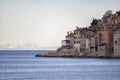 Beautiful, dense built houses of the adriatic town of Rovinj, with recognizable colorful facades against the barely visible