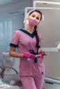 Dentis in pink uniform at the clinic Royalty Free Stock Photo