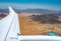 Beautiful desert landscape aerial view with mountains. view from the plane. landscape of mountains peaks in desert. Mountains in Royalty Free Stock Photo