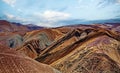 Beautiful desert landscape, barren surreal dry colorful mountains, blue summer sky, fluffy cloud - Coridillera de Copiapo, Atacama