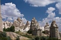 beautiful desert rocky sandstone love valley with huge troglodytes rising up in blue sky Royalty Free Stock Photo