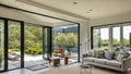 Wide-Angle Shot of Modern House Sunroom Living Area with Mid-Century Minimalistic Interior Design and Open Concept Layout . Royalty Free Stock Photo