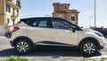 Beautiful design of profile view of ivory color vehicle model Renault Captur manufactured by French Renault automotive industry