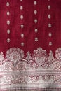 Beautiful design on red and white silk fabric. Royalty Free Stock Photo