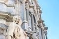 Beautiful detail of Antique statue on Catania Cathedral with blurred Roman Catholic shrine in the background. The Baroque Duomo