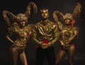 Beautiful devil women with golden ornamental horns and handsome devil man in ornamental jacket Royalty Free Stock Photo