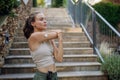 Beautiful diabetic woman preparing for outdoor run in the city.