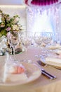 Beautiful dining table full of a variety of delicious festive food and wine with a Christmas tree in the background in warm mood