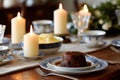Traditional Christmas pudding on a dining table with elegant decor Royalty Free Stock Photo