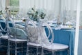 Beautiful dinner setting, long table set for an event on a terrace.