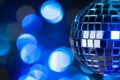 Beautiful disco ball on dark bokeh background Royalty Free Stock Photo