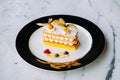 Beautiful dish of Millefeuilles French puff pastry on elegant pl