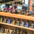 Beautiful display of bronze Buddha, Ganesh and Asian woman statues