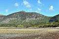 Beautiful, distant mountains at the Welsh seaside. The shingle beach at the small seaside village of Trefor on the Llyn