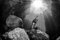 Beautiful diver underwater with sun rays