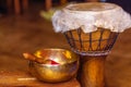 Beautiful djembe and tibetian bowl with golden light reflections.