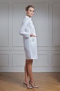 Beautiful doctor in white clothes. Portrait of attractive medic in white robe Royalty Free Stock Photo