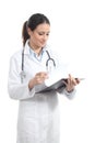 Beautiful doctor woman smiling and taking notes Royalty Free Stock Photo