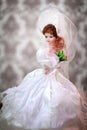 Beautiful doll bride in a wedding dress Royalty Free Stock Photo