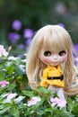 Beautiful doll in the garden