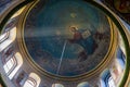 Beautiful dome in an orthodox cathedral, church. Beautiful Christian murals. The sun\'s rays illuminate the dome beautifully.