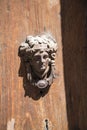 Beautiful Door Knocker on an ancient door in Rome Italy Royalty Free Stock Photo