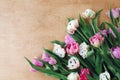 Beautiful double peony tulips flat lay on wooden table, space for text. Colorful pink and purple tulips. Happy mother`s day. Royalty Free Stock Photo