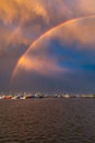 Beautiful double rainbow over the sea and coast full of small private boats right after the storm and rain Royalty Free Stock Photo